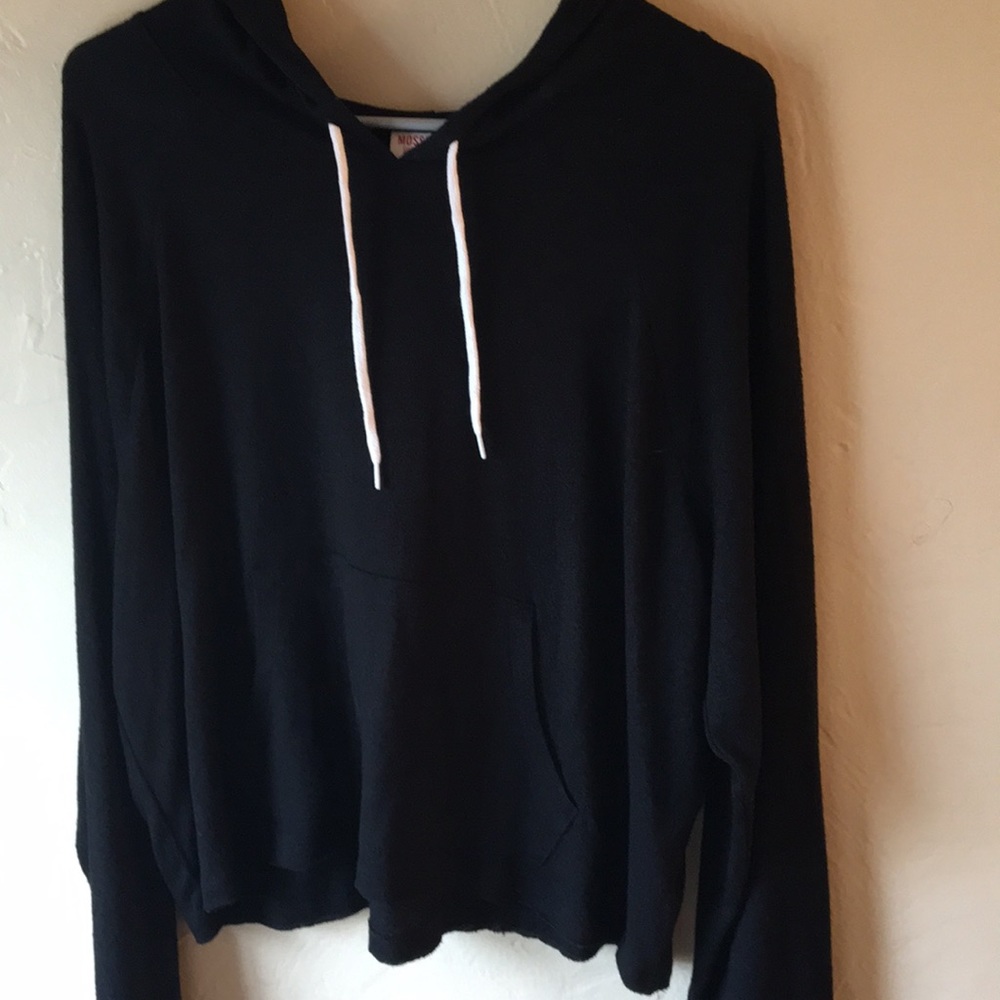 Black long sleeve sweater with a hood